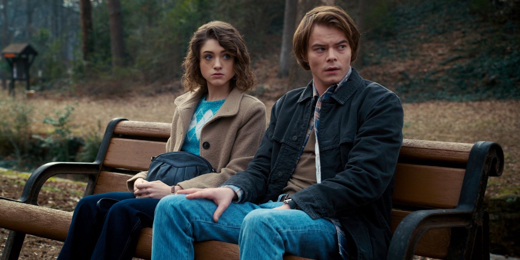 Nancy and Jonathan sit on a bench in the park in Stranger Things Season 2