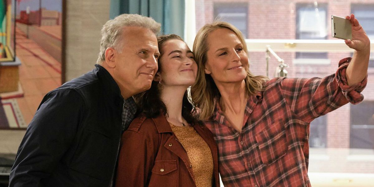 Paul, Mabel, and Jamie talking a photo on a phone on Mad About You