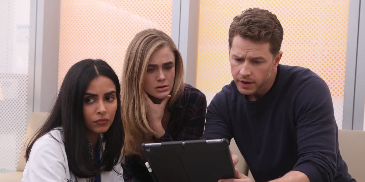 Saanvi, Michaela, and Ben looking at a tablet on Manifest.