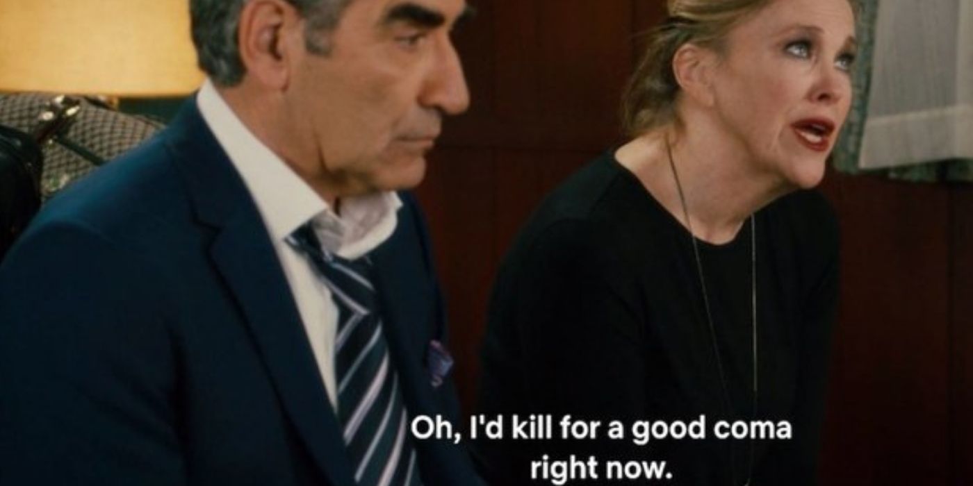 Moira sits next to John as she wishes for a deep coma on Schitt's Creek