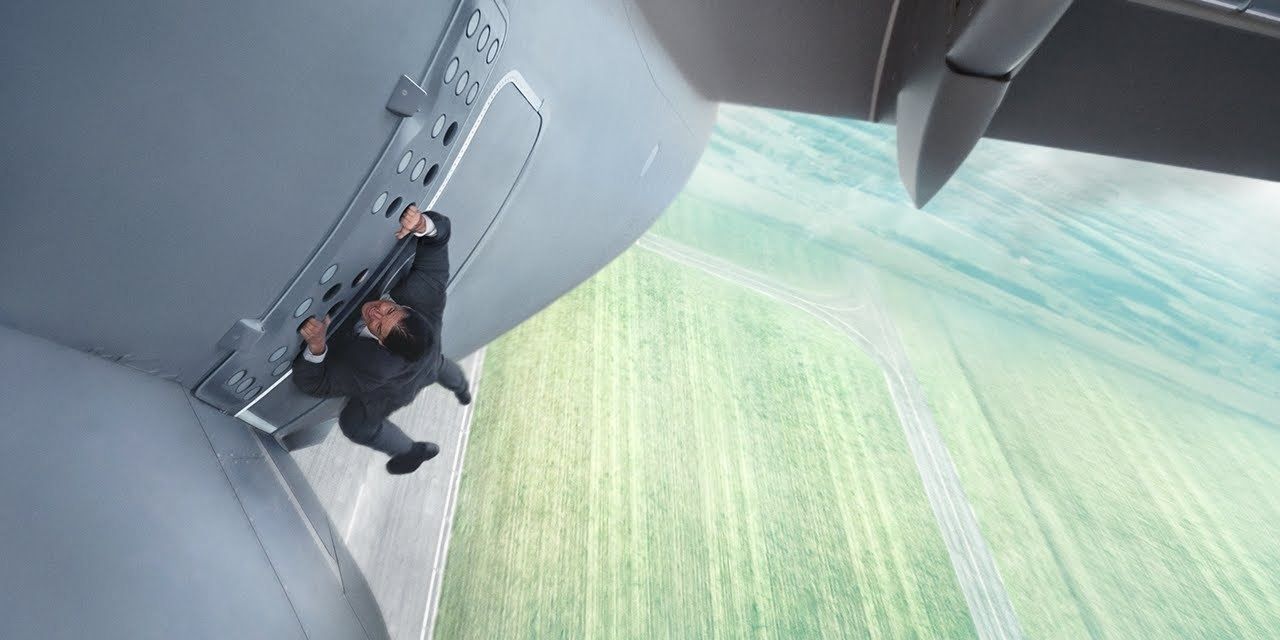 Ethan Hunt hangs on the side of a plane in Mission: Impossible - Rogue Nation