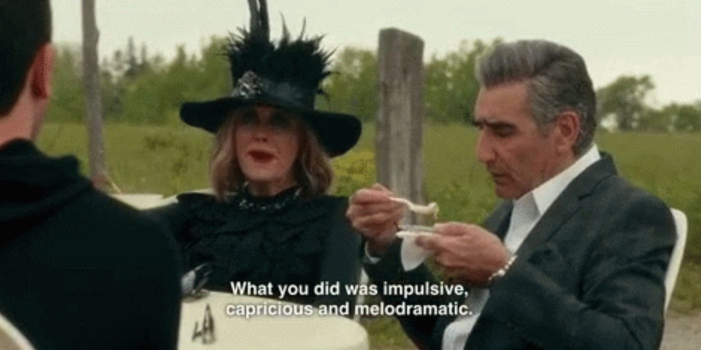 Moira (Catherine O'Hara) sits outside while talking to John (Eugene Levy) at a winery on Schitt's Creek