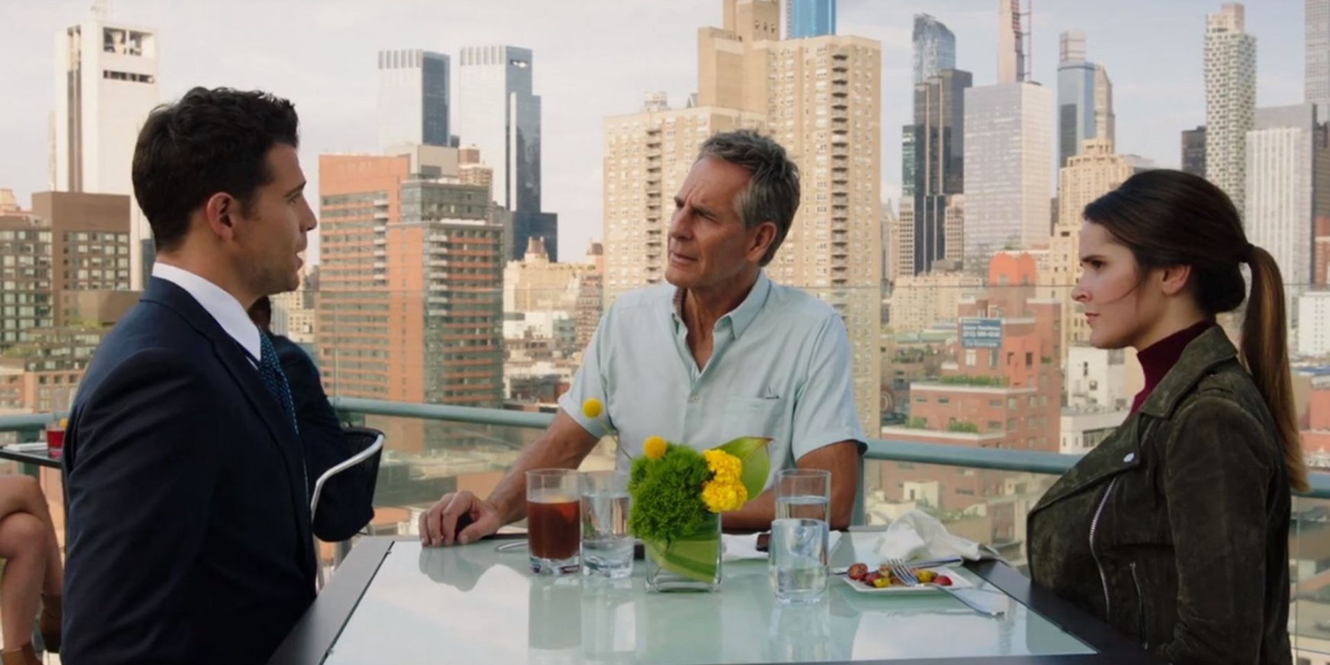Laurel and Dwayne Pride talk with a detective at a rooftop restaurant in New York in NCIS New Orleans Bad Apple S6E03