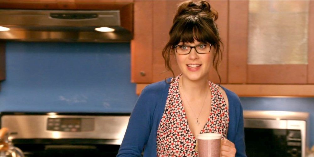 Jess talks to Nick in the kitchen in New Girl