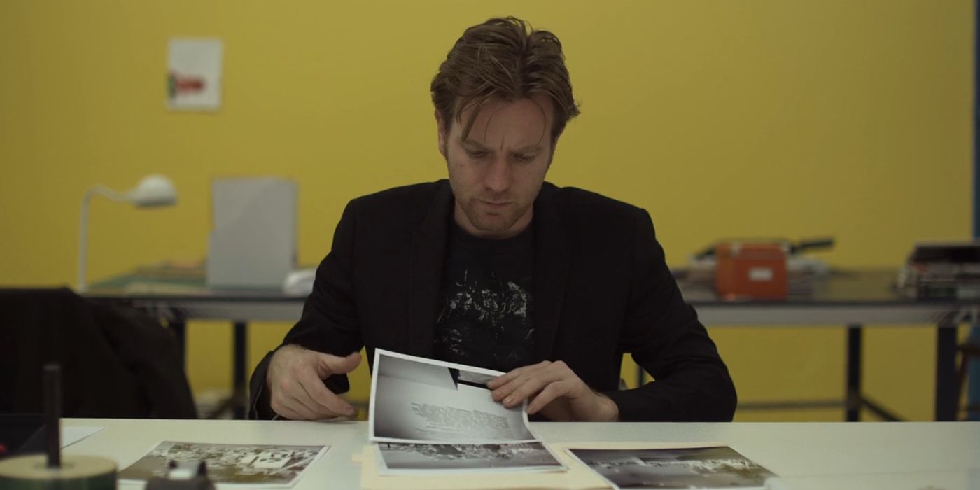 Oliver looking at photos in Beginners.