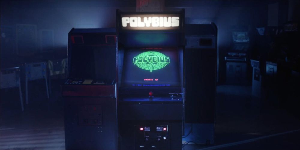 An arcade game labeled 'Polybius' glowing in a dark room.