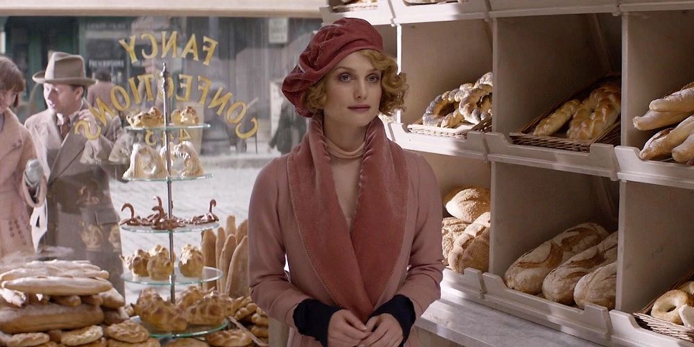 An image of Queenie Goldstein standing in a bakery in Fantastic Beasts
