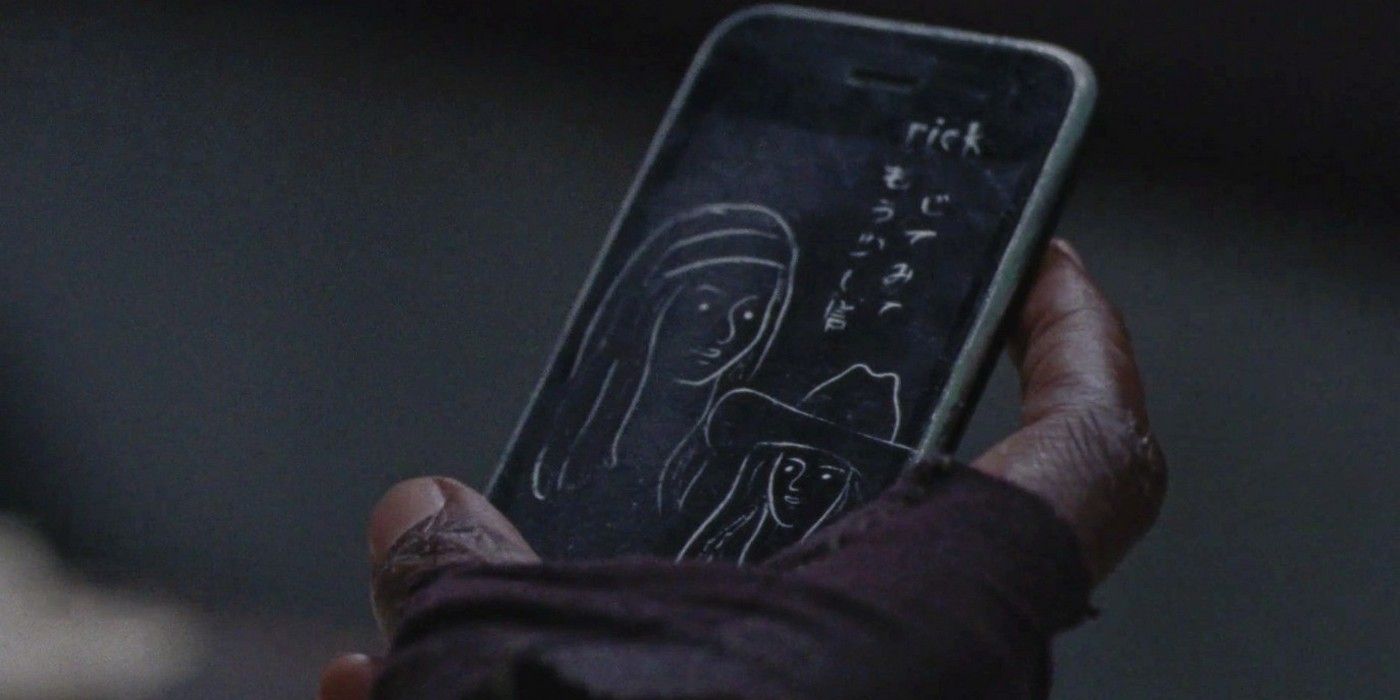 Rick iPhone message in The Walking Dead with images and text scrawled on it