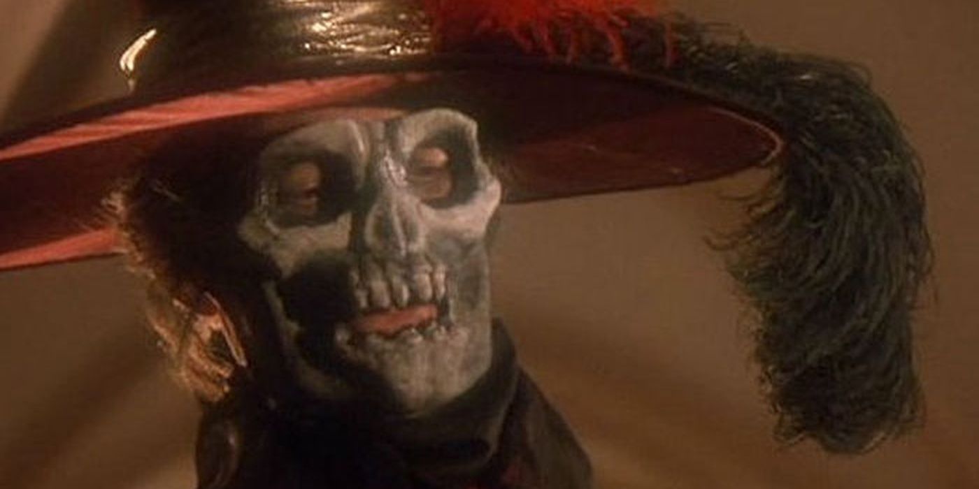 Robert Englund in a skull mask in the Phantom's masquerade outfit