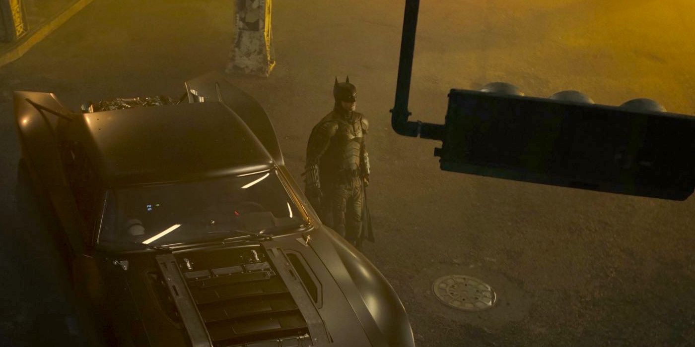 Robert Pattinson and Batmobile in The Batman