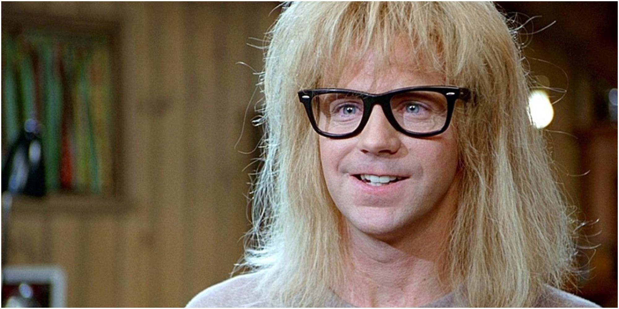 Dana Carvey from SNL grits his teeth while wearing glasses.