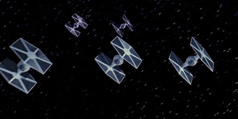 TIE Fighters fly through space on the pursuit of Rebel ships 