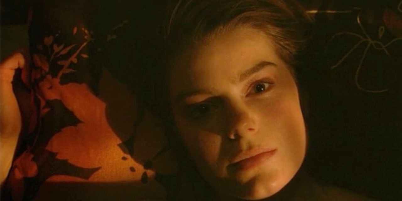 Sketch from Skins lays in her bed in the dark looking up at the camera