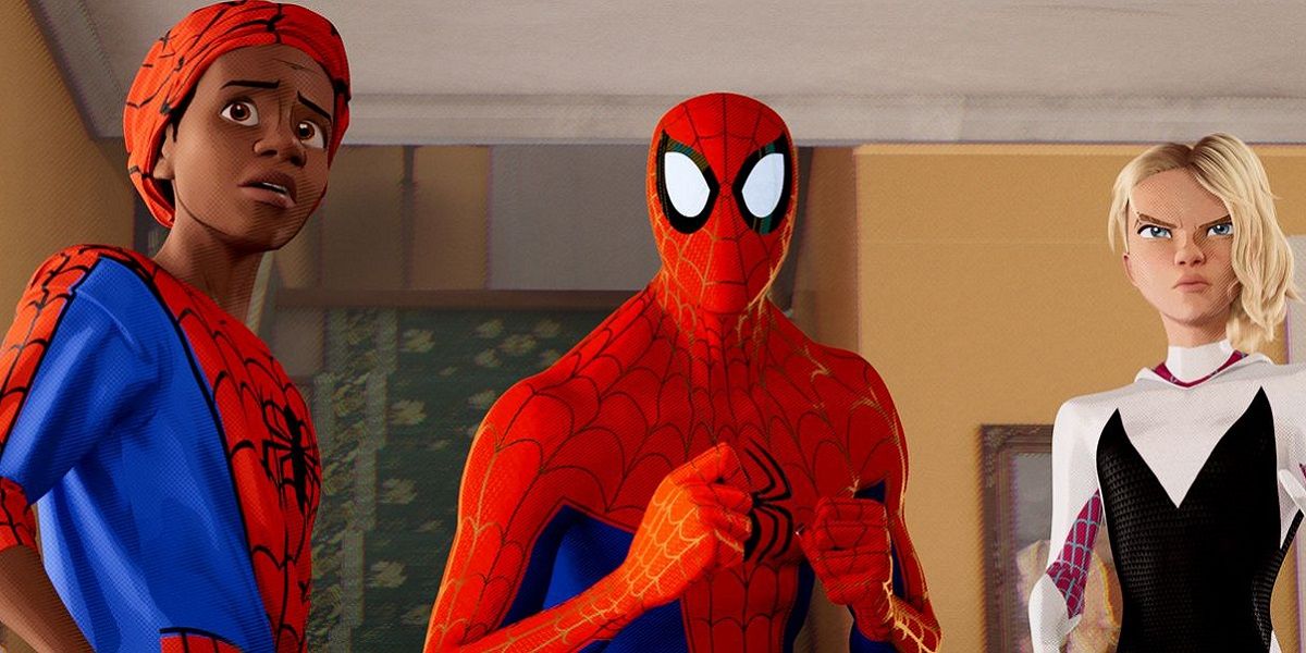 Three versions of Spider-Man standing in a living room in Spider-Man: Into The Spider-Verse.