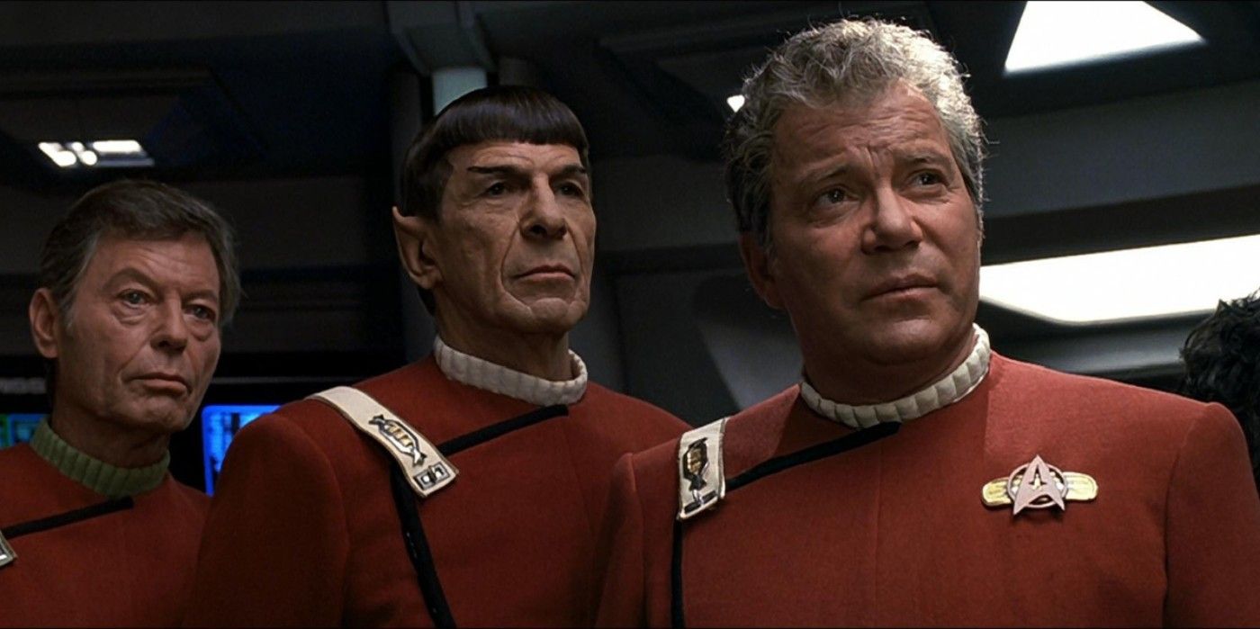 Kirk, Spock, and McCoy look on from Star Trek VI