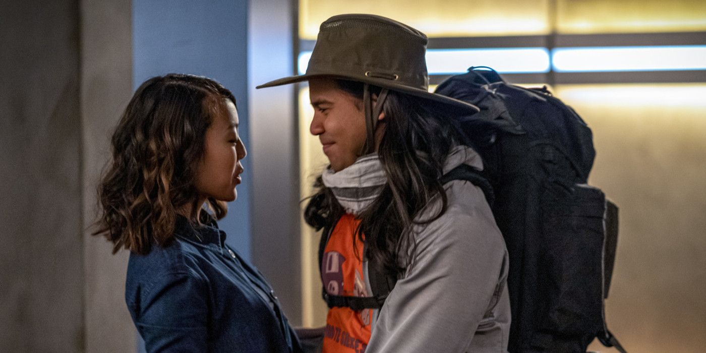 Cisco dressed in hiking gear and face to face with Kamilla Hwang in The Flash