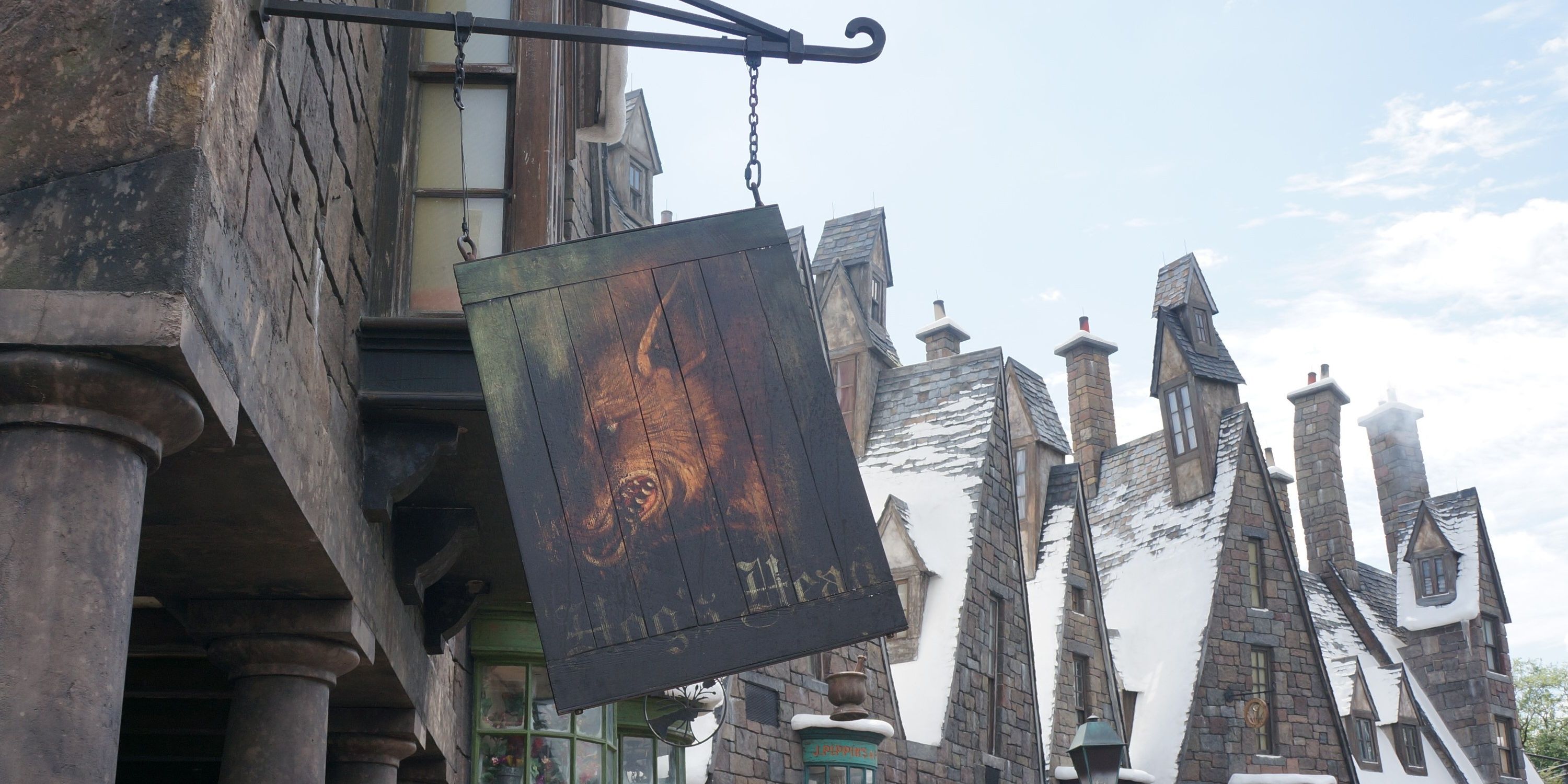 The outside sign of the Hog's Head Inn in the Harry Potter franchise