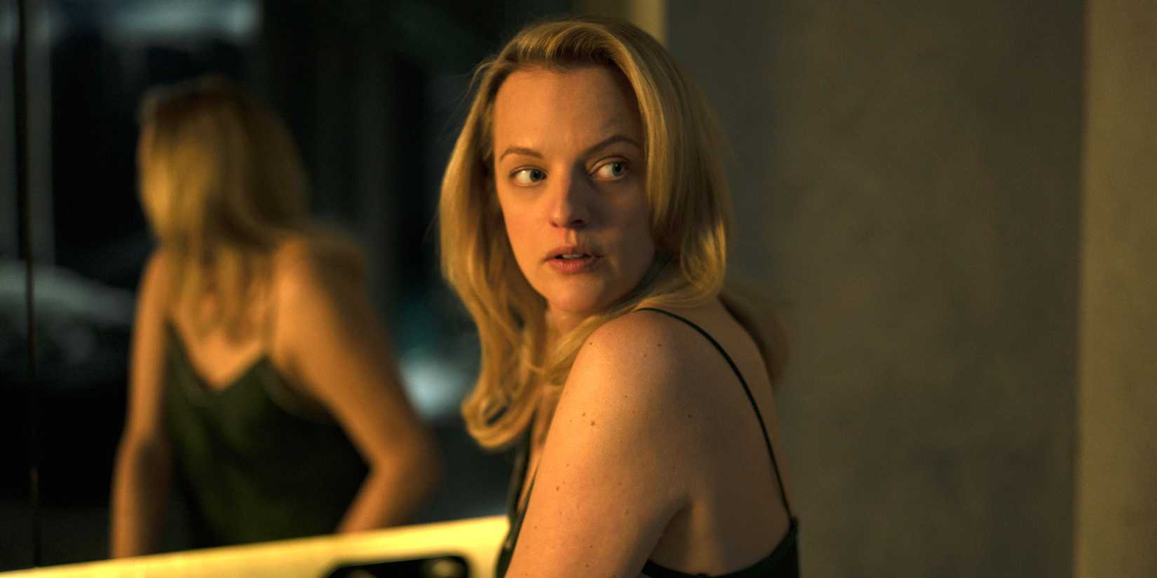 Elisabeth Moss as Cecilia looking behind her in her Invisible Man 2020