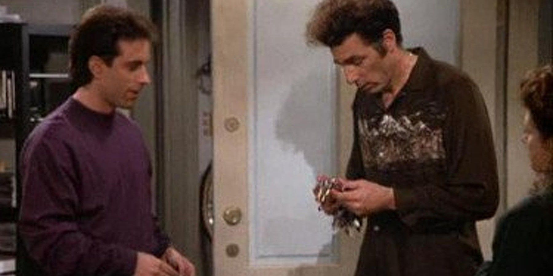 Jerry and Kramer talking in the apartment hallway on Seinfeld