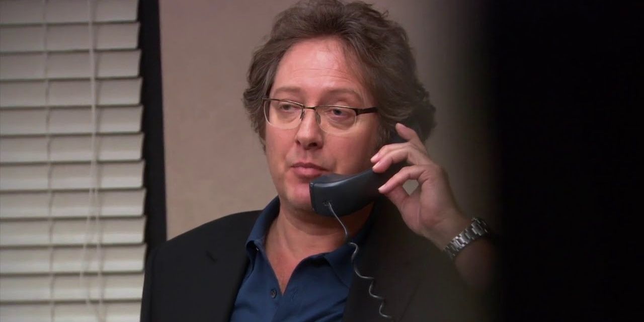 Robert is on the phone to Andy, who is trying to threaten him in The Office
