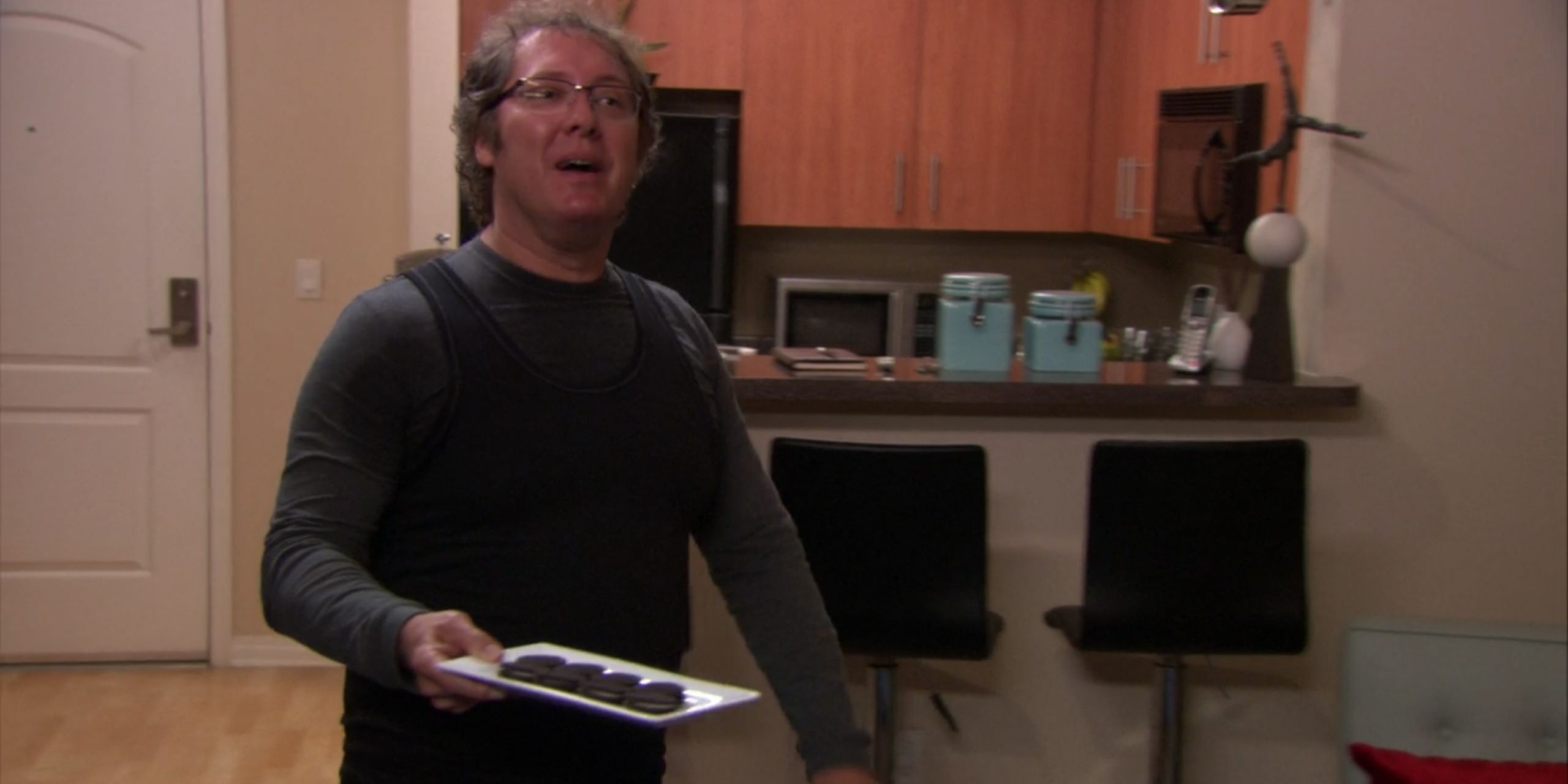 Robert offers Oreos to Dwight in his apartment in The Office