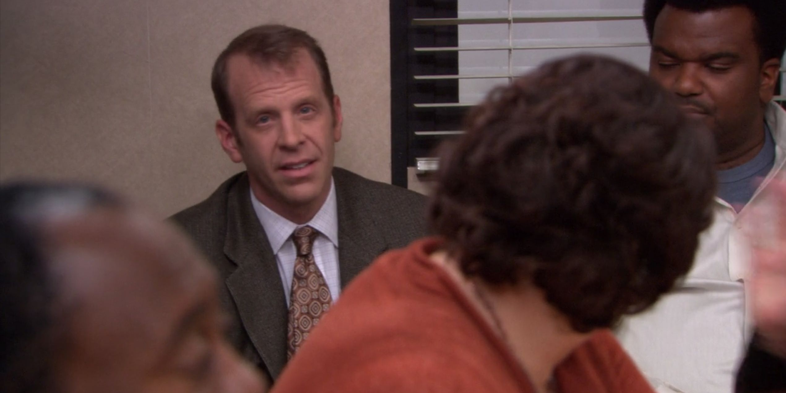 Toby speaking up in an office meeting on The Office