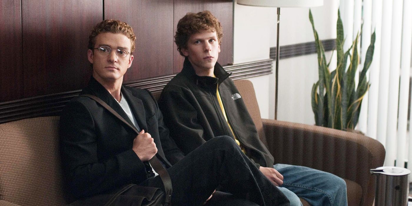 Justin Timberlake as Sean Parker in The Social Network with Jesse Eisenberg, sitting on sofa.