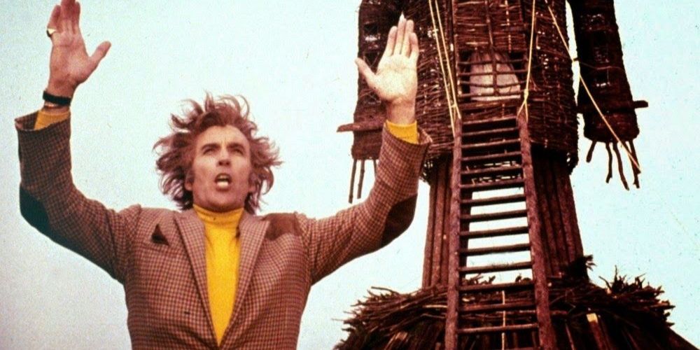 Christopher Lee as Lord Summerisle raising his hands in the Wicker Man