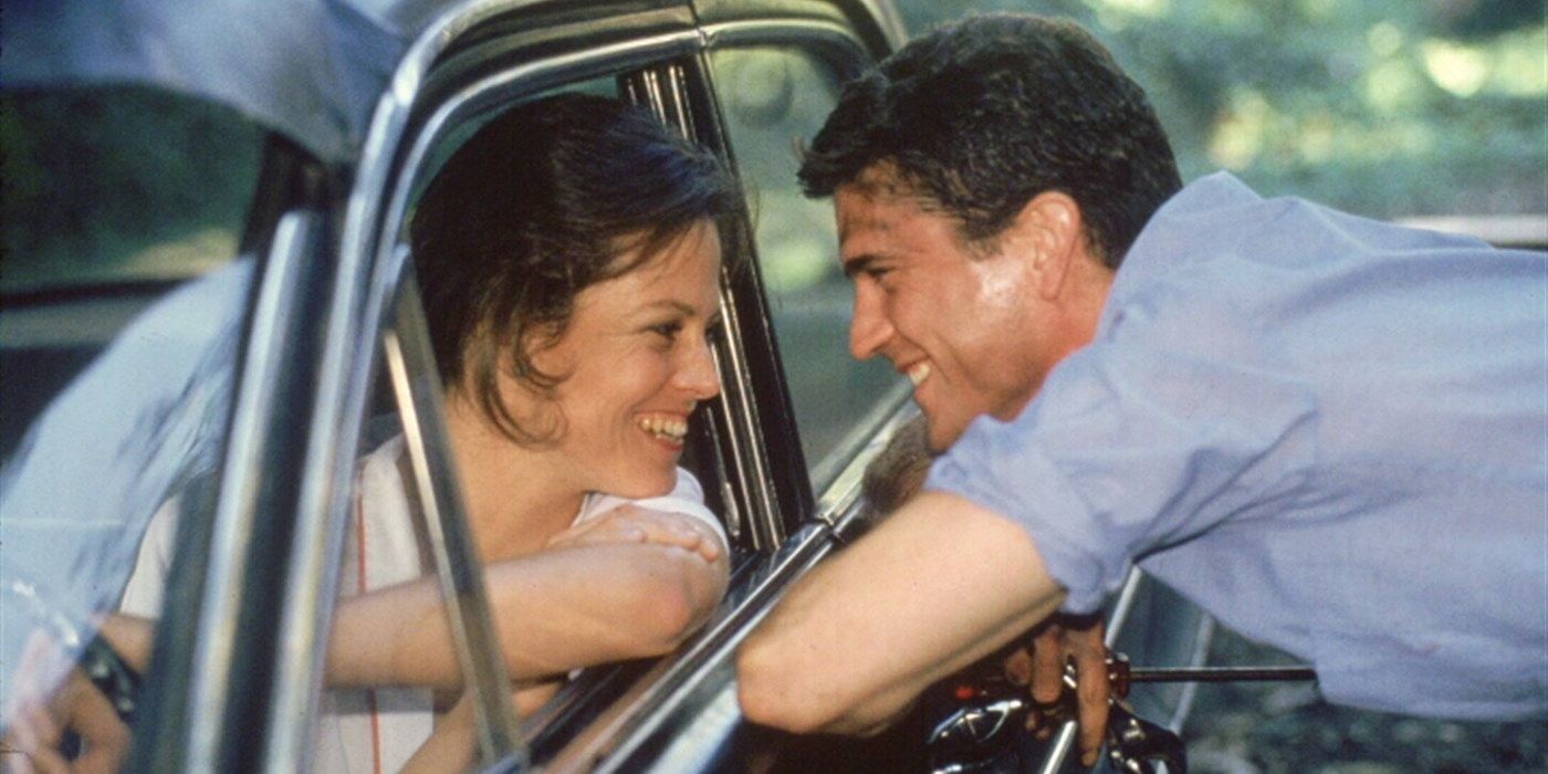 Mel Gibson chats with Sigourney Weaver from outside her car in The Year of Living Dangerously