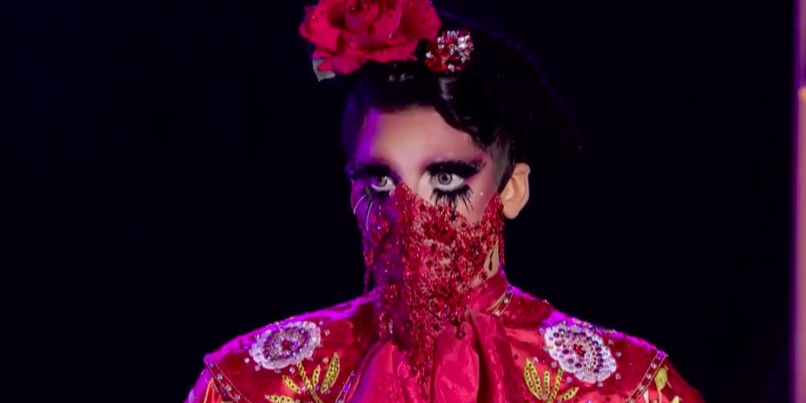 Valentina wears a mask on the main stage of RuPaul's Drag Race season 9