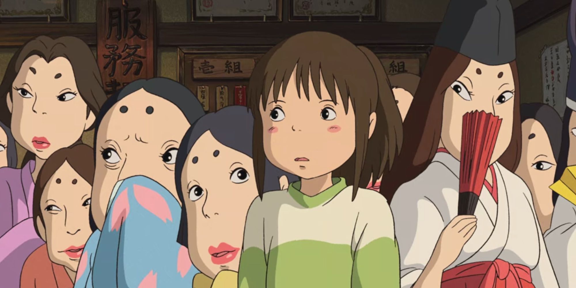 The bathhouse workers look at Chihiro warily in Spirited Away
