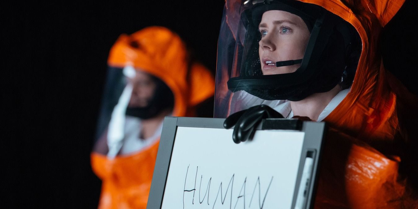 Louise Banks holding a white board in Arrival