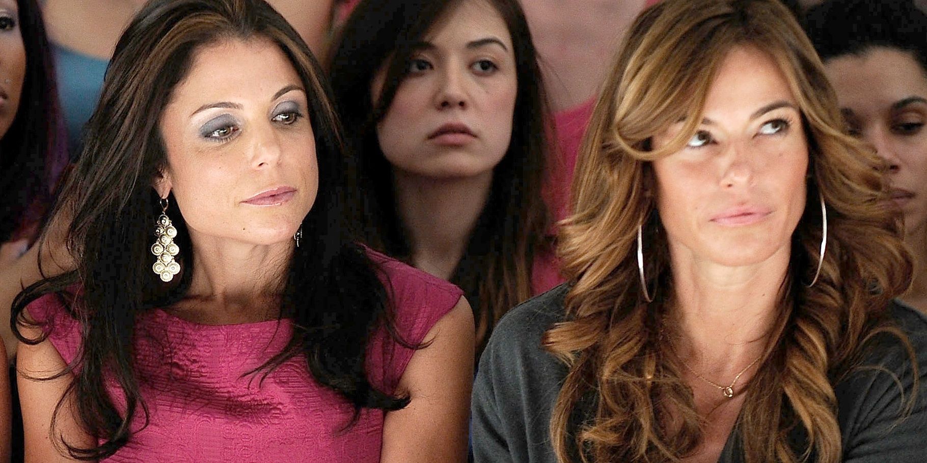 Kelly sits with Bethenny at a runway fashion show in RHONY.