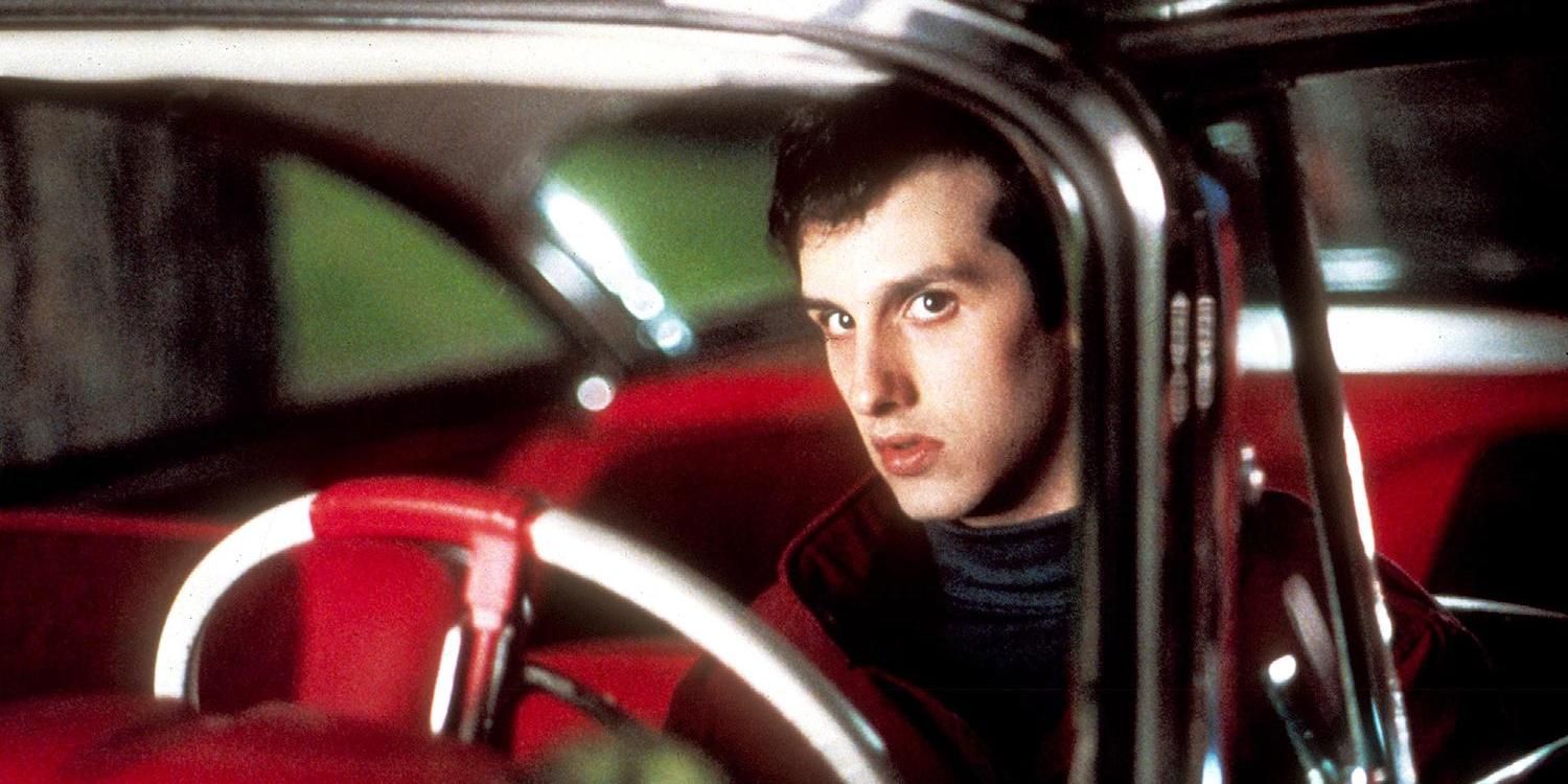 Keith Gordon sitting in Christine car.