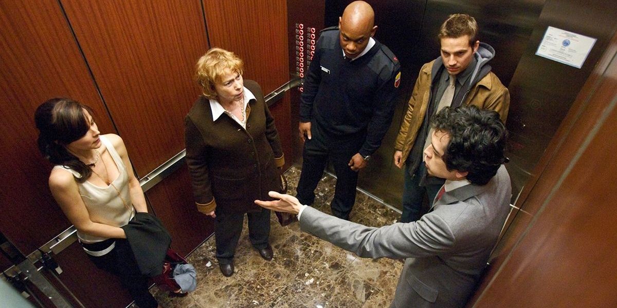 Characters stuck in an elevator in from Devil (2010)