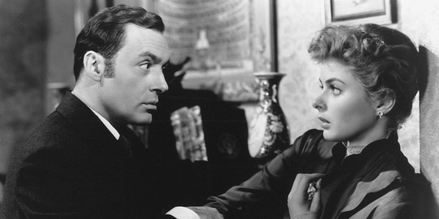 Gregory looks intently at a scared Paula in Gaslight