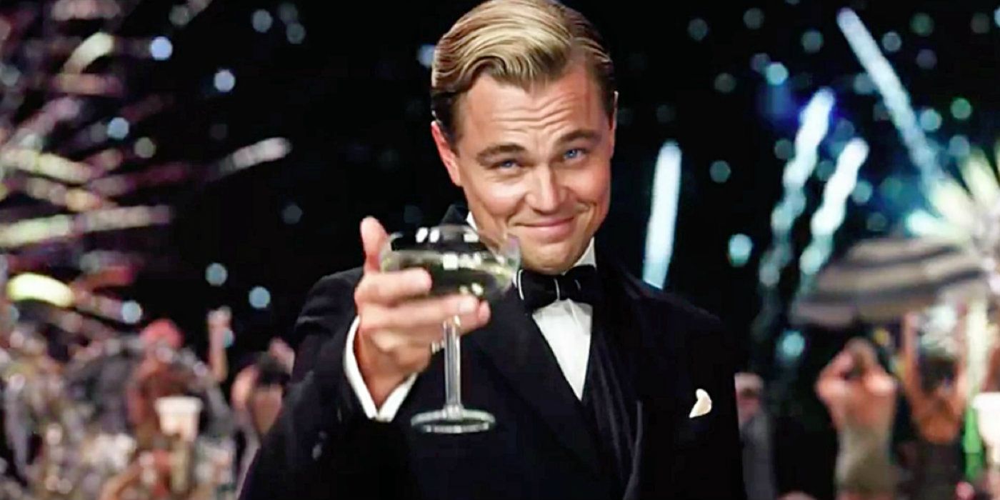 Leonardo DiCaprio holding a champagne glass in The Great Gatsby