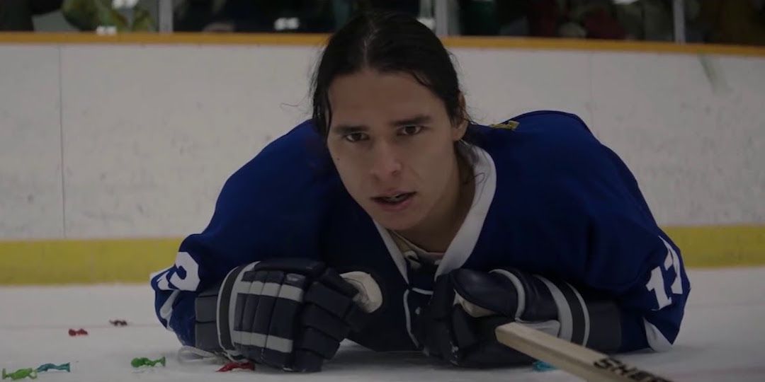 Saul lying on the ice in Indian Horse