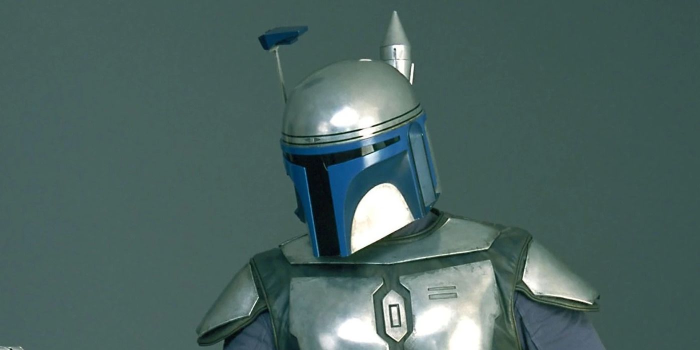 Jango Fett looking down in his helmet in front of a gray background
