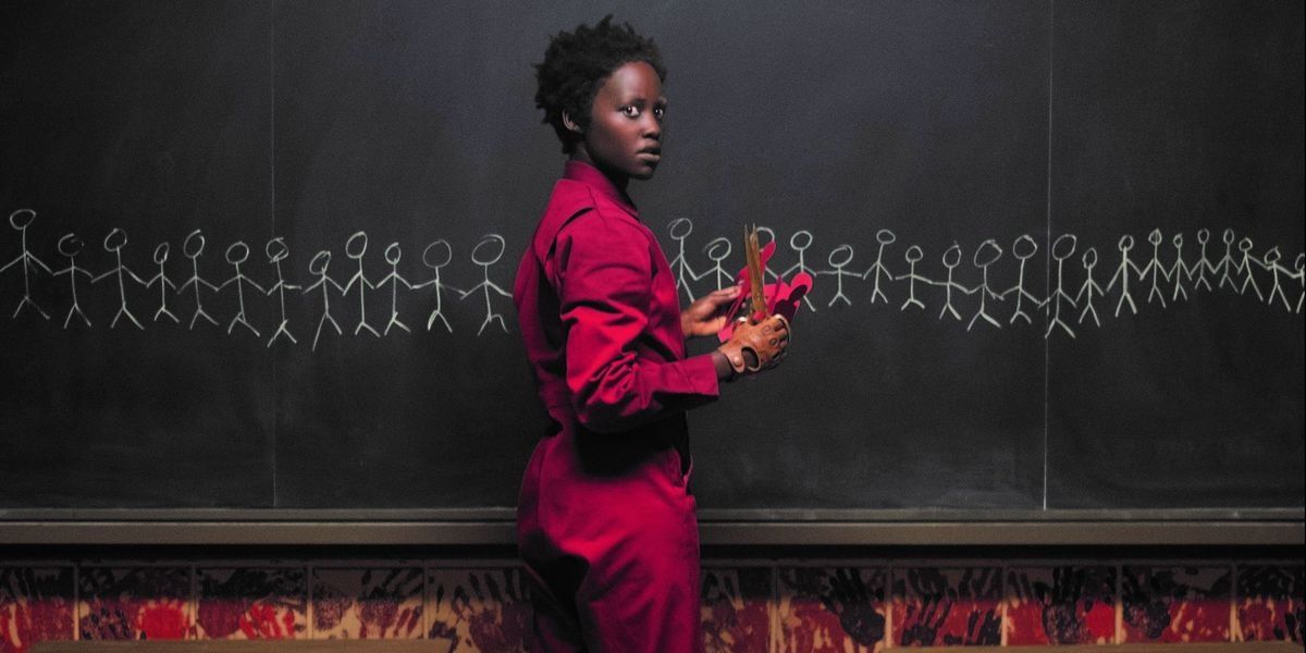 Adelaide in front of a chalkboard in Us