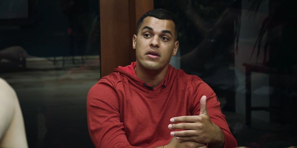 Josh Martinez in Big Brother talks to someone off camera.