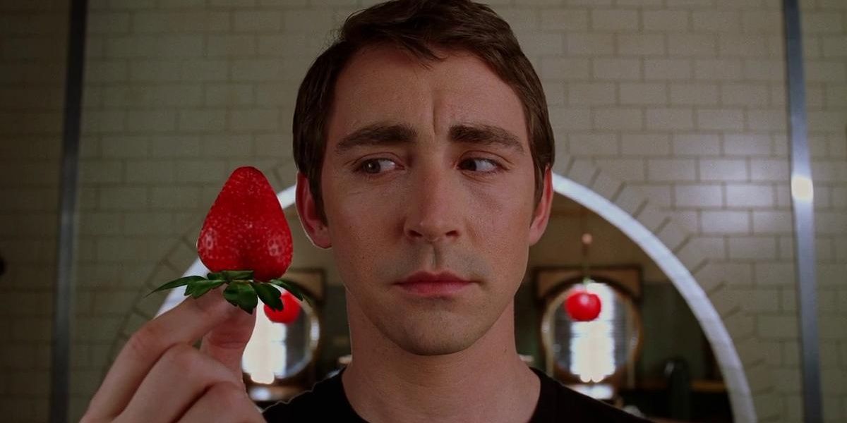 Ned looking at a strawberry in Pushing Daisies.