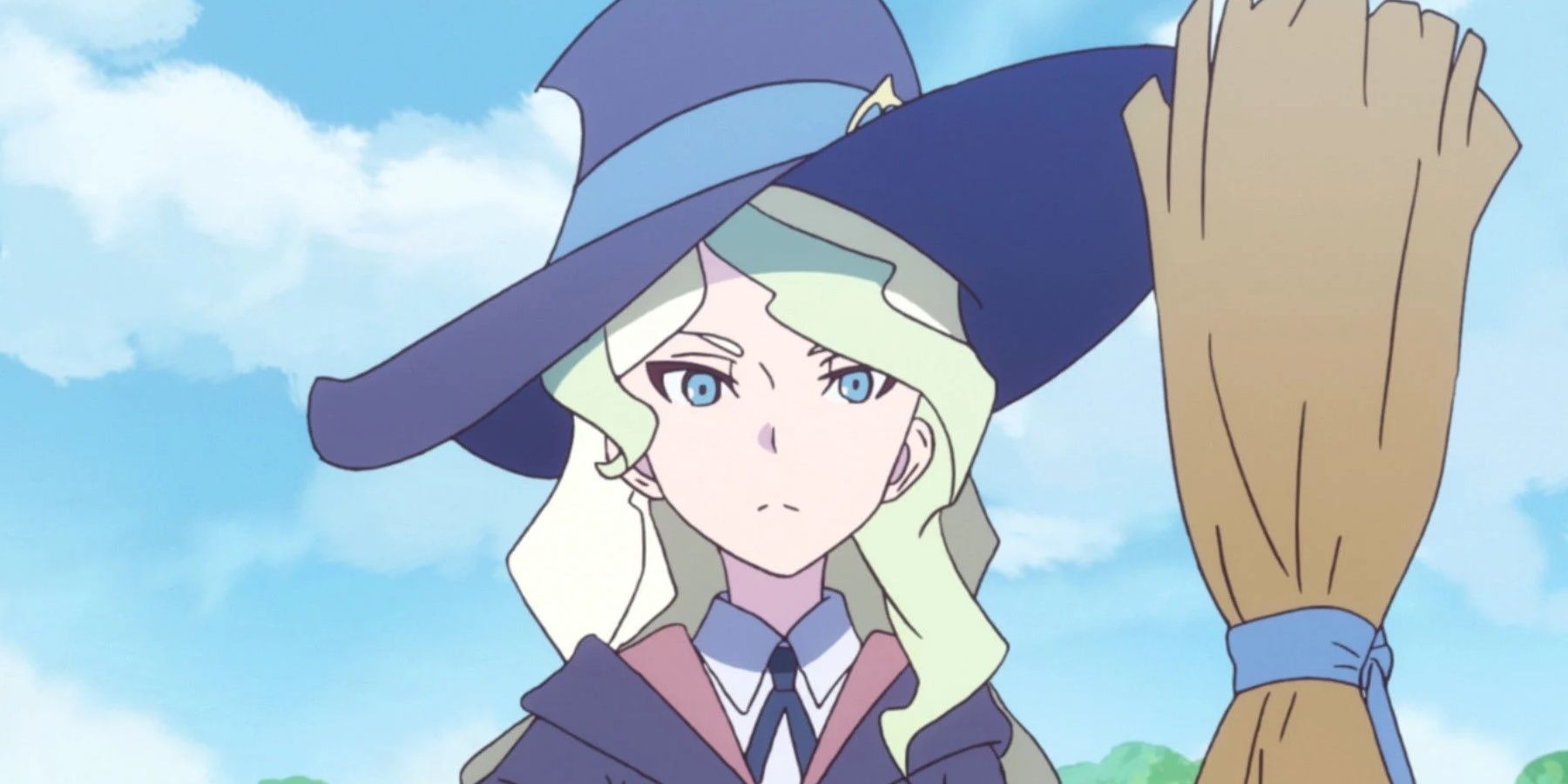 Diana wearing a witch's hatr and holding a broom in Little Witch Academia