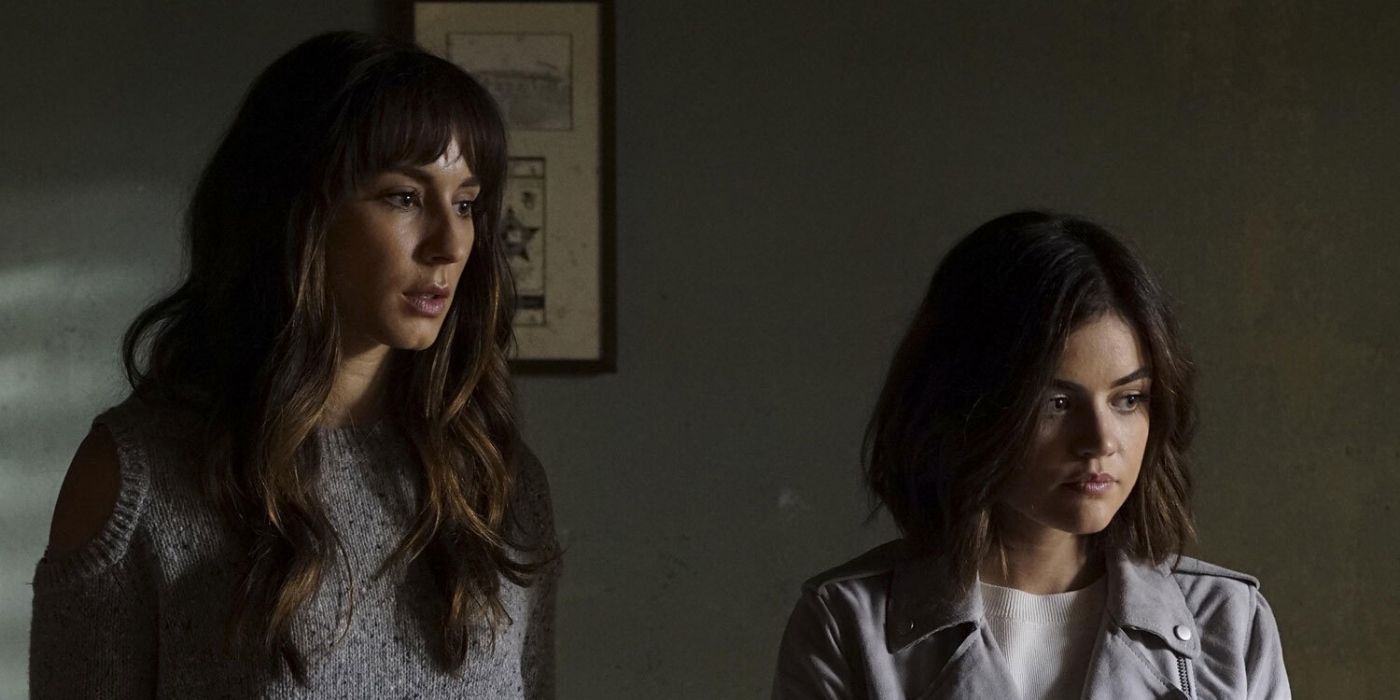 Spencer and Aria standing together on Pretty Little Liars