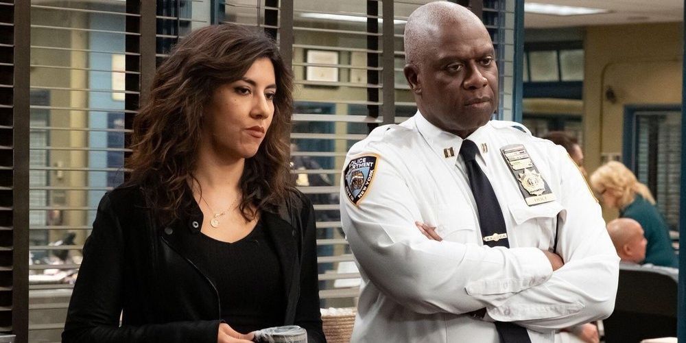 Rosa and Holt standing together at the office on Brooklyn Nine-Nine