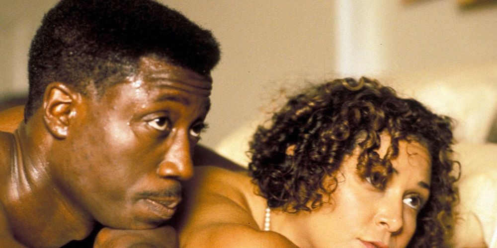 A man and a woman lying on a bed together in Jungle Fever