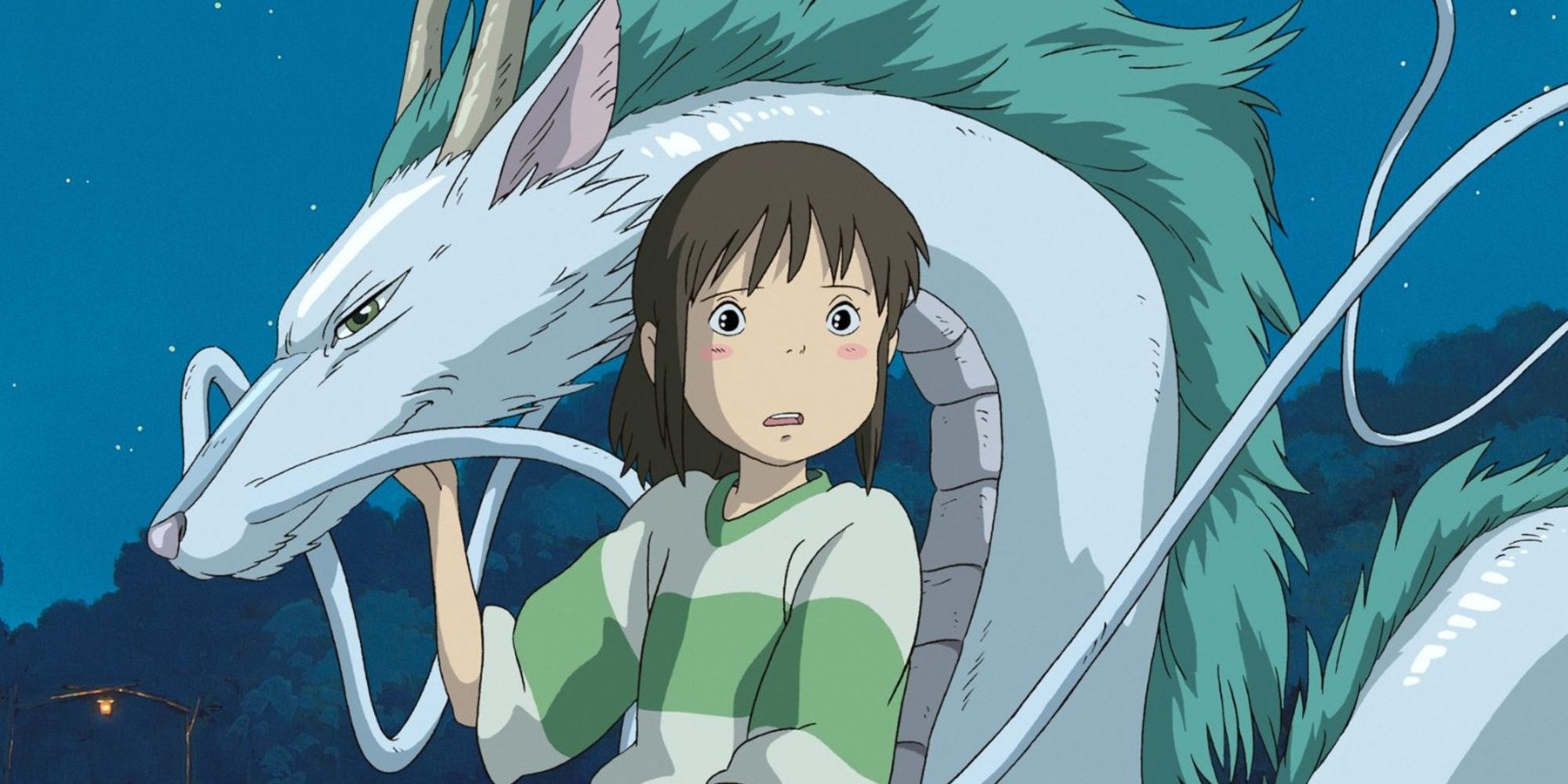 Chihiro holds a dragon and looks at something offscreen in Spirited Away.