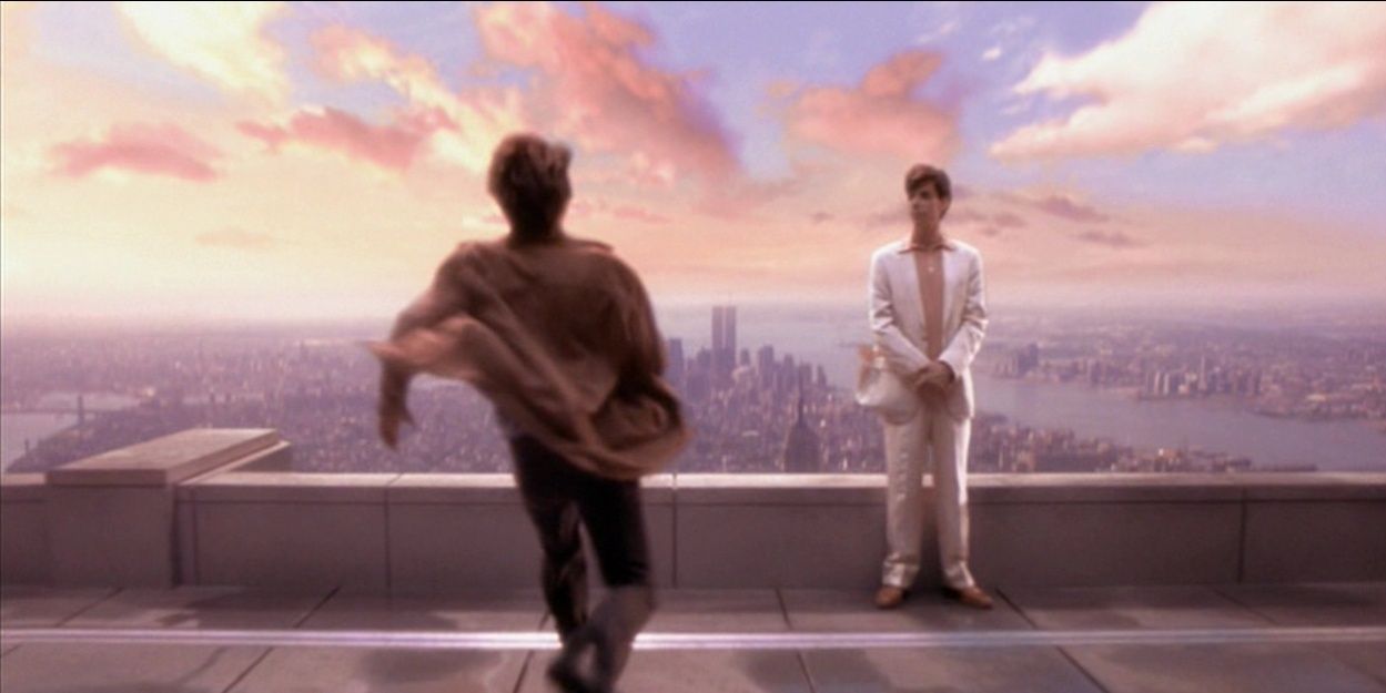 Tom Cruise running to Noah Taylor on a rooftop in Vanilla Sky.