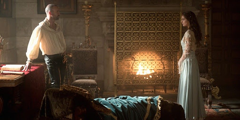 A conversation in a fire-lit room in Reign
