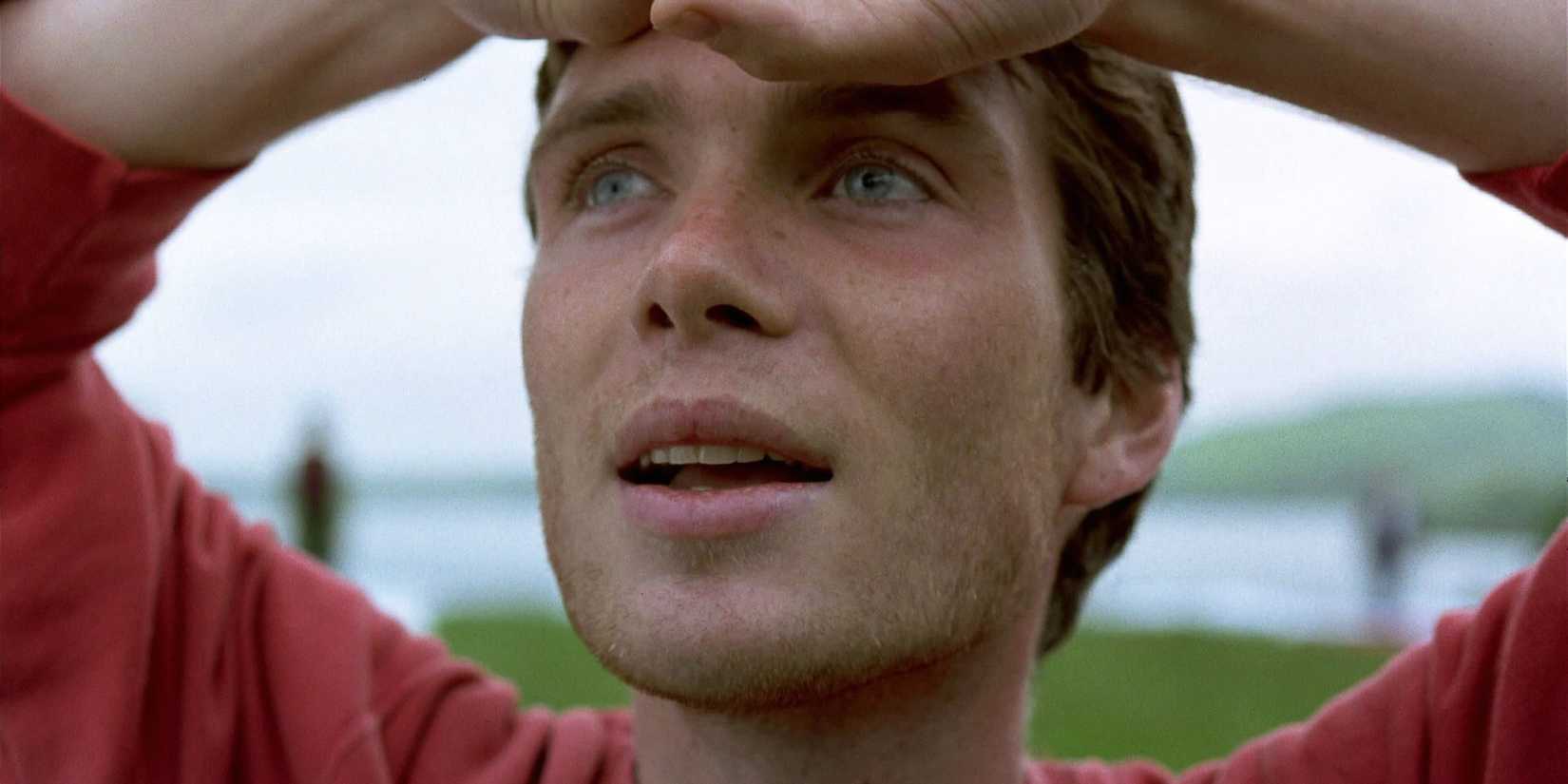 Cillian Murphy as Jim smiling in 28 Days Later's ending.